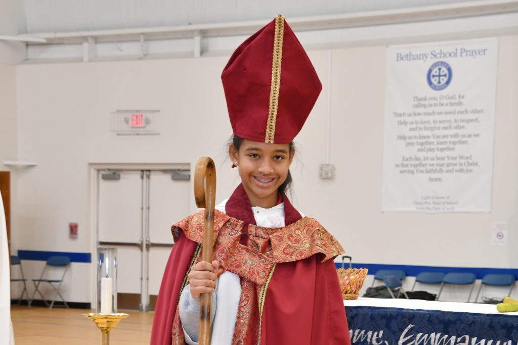 A student serves as Child Bishop during a Saint Nicholas Day worship service. The Child Bishop program is designed to recognize students who show generosity, charity, and kindness to their peers.